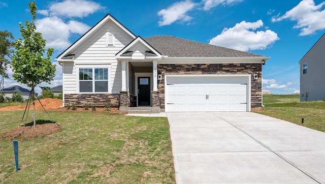1312 Salix Ct, Spartanburg, SC 29303 - craftsman-style home with stone siding, a front yard, concrete driveway, and an attached garage