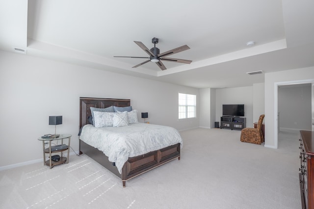 142 Magnolia St, Woodruff, SC 29388 - bedroom with a tray ceiling, light carpet, and a ceiling fan