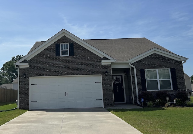 1278 Elterwater Ln, Spartanburg, SC 29306 - view of front of house featuring concrete driveway, brick siding, a shingled roof, and an attached garage