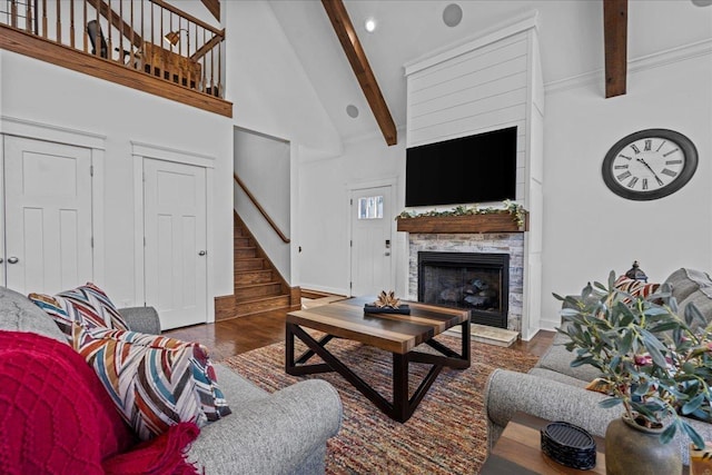 3664 River Rd, Union, SC 29379 - living room with beamed ceiling, stairs, wood finished floors, a fireplace, and high vaulted ceiling