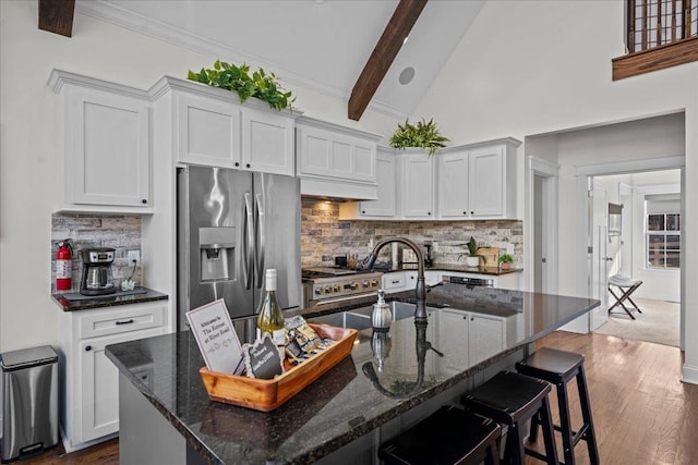 3664 River Rd, Union, SC 29379 - kitchen with stainless steel fridge with ice dispenser, backsplash, a breakfast bar area, and dark wood-style floors