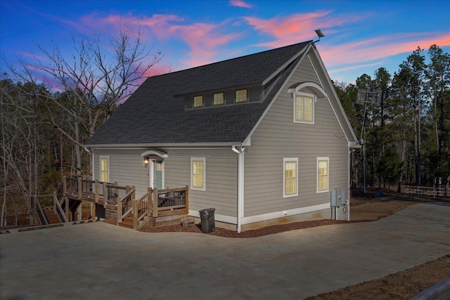 3664 River Rd, Union, SC 29379 - back of property at dusk with a shingled roof, a deck, and concrete driveway