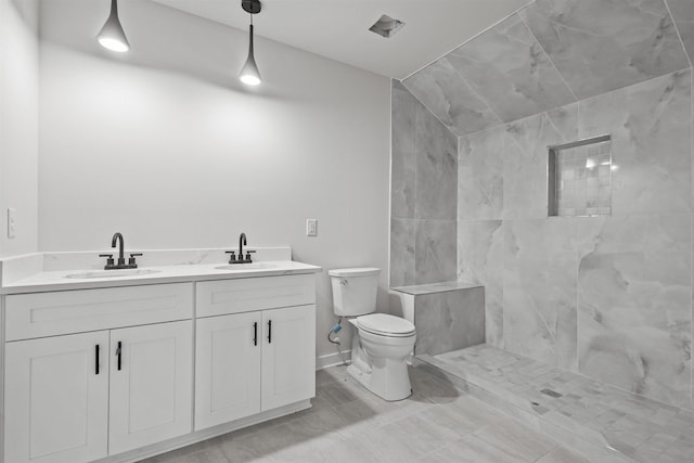 101 Daisy Ln, Easley, SC 29640 - bathroom featuring tiled shower and double vanity
