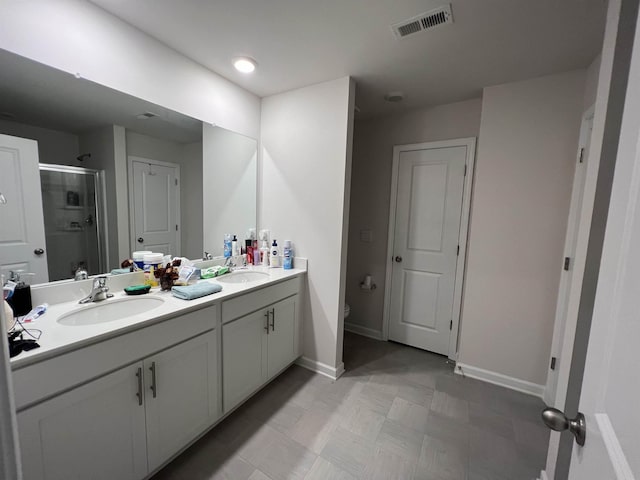 1341 Wunder Way, Boiling Springs, SC 29316 - bathroom featuring double vanity, a shower stall, and tile patterned floors