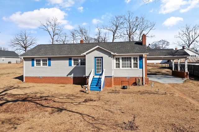 371 Tucapau Rd, Wellford, SC 29385 - view of front of home with entry steps, crawl space, a shingled roof, and a chimney