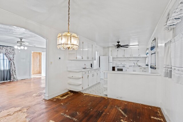 371 Tucapau Rd, Wellford, SC 29385 - kitchen with ceiling fan, wood-type flooring, white appliances, white cabinetry, and light countertops