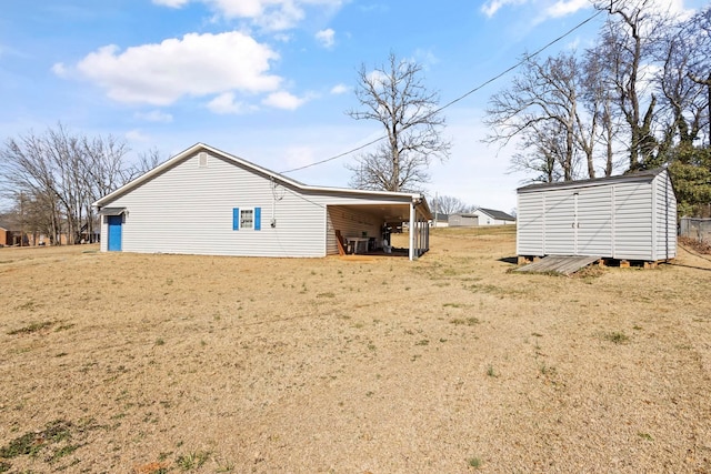 371 Tucapau Rd, Wellford, SC 29385 - view of side of property featuring a storage shed and a yard