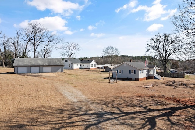 371 Tucapau Rd, Wellford, SC 29385 - view of yard with a garage, dirt driveway, and an outdoor structure