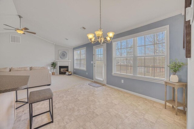 106 Brandi Starr Ct, Greer, SC 29651 - dining room with ornamental molding, a chandelier, vaulted ceiling, a fireplace, and a ceiling fan