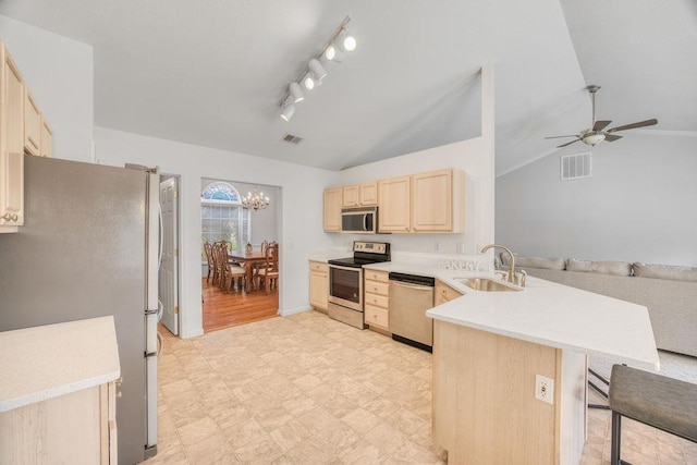 106 Brandi Starr Ct, Greer, SC 29651 - kitchen featuring appliances with stainless steel finishes, light brown cabinetry, a peninsula, ceiling fan, and light flooring