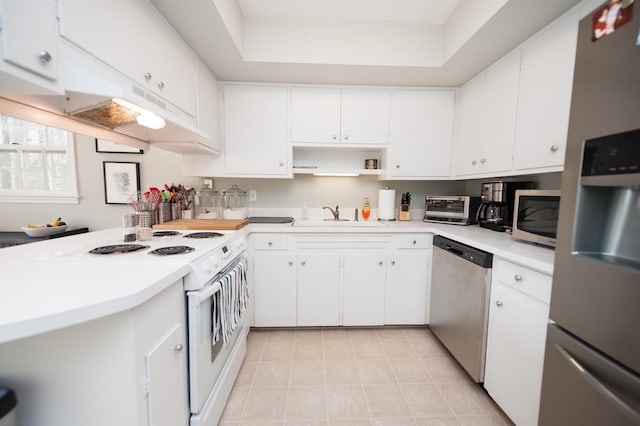 1105 Partridge Rd, Spartanburg, SC 29302 - kitchen with stainless steel appliances, light countertops, light tile patterned floors, and white cabinetry