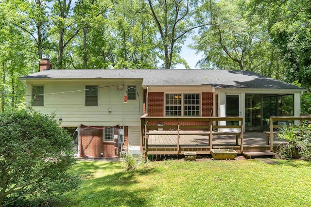 1105 Partridge Rd, Spartanburg, SC 29302 - rear view of property featuring a chimney, a wooden deck, a sunroom, brick siding, and a lawn