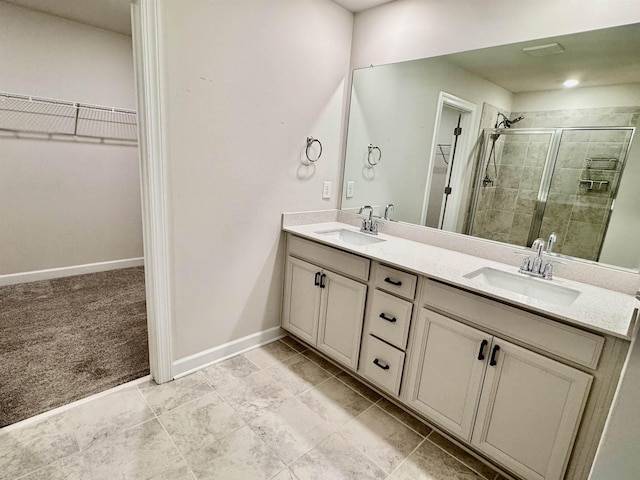 637 Grays Creek Rd, Spartanburg, SC 29303 - bathroom featuring a walk in closet, double vanity, and a shower stall