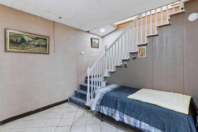 1109 Hemlock Dr, Shelby, NC 28150 - staircase featuring tile patterned floors and a drop ceiling