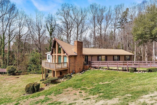 1109 Hemlock Dr, Shelby, NC 28150 - back of property with a yard, a wooden deck, and a chimney