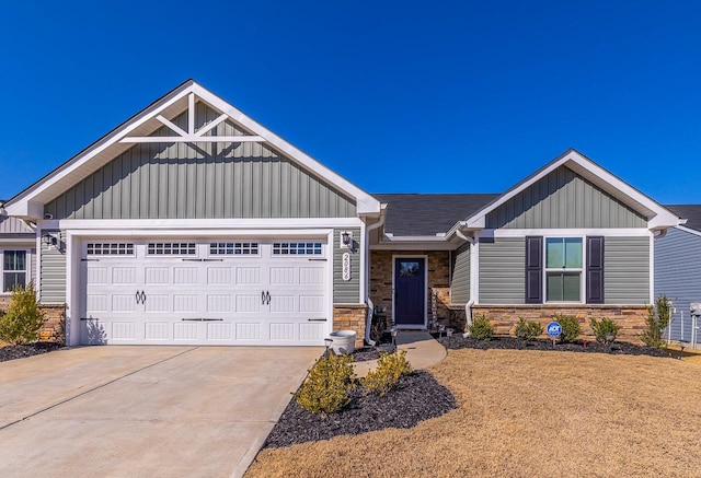 2086 Wexley Dr, Boiling Springs, SC 29316 - view of front of home with stone siding, board and batten siding, an attached garage, and concrete driveway