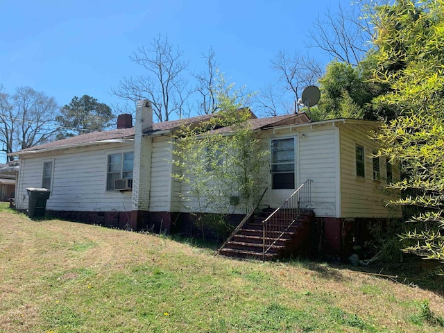 311 Arthur Blvd, Union, SC 29379 - back of house with a yard, a chimney, and cooling unit