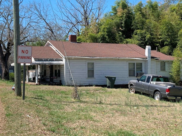 311 Arthur Blvd, Union, SC 29379 - view of front facade with a front yard, a chimney, cooling unit, and a shingled roof