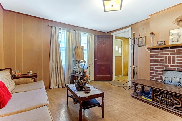 163 Railroad St, Enoree, SC 29335 - living area featuring wooden walls, a brick fireplace, and crown molding