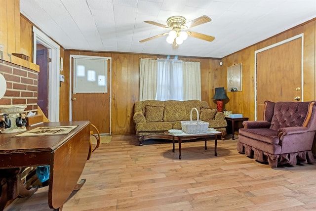 163 Railroad St, Enoree, SC 29335 - living room featuring ceiling fan, light wood-style floors, and wooden walls