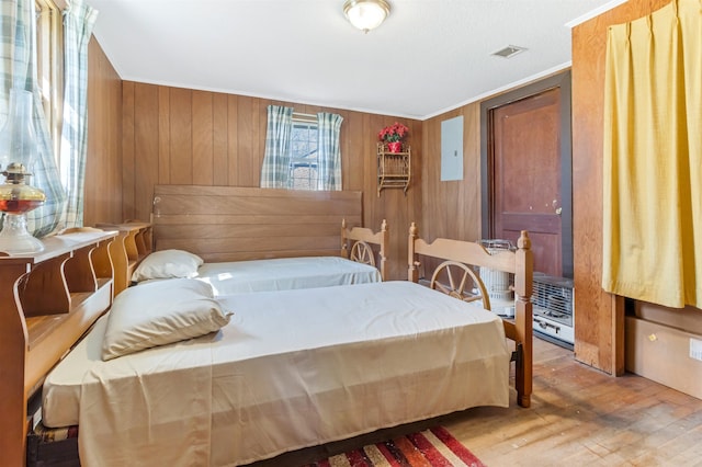 163 Railroad St, Enoree, SC 29335 - bedroom with wood finished floors, wooden walls, and ornamental molding