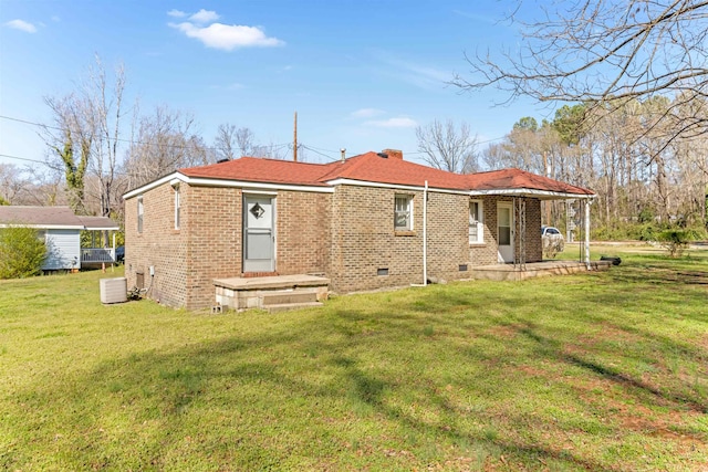 163 Railroad St, Enoree, SC 29335 - rear view of property featuring crawl space, a yard, brick siding, and a chimney