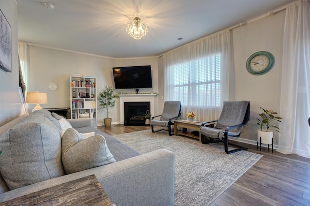 1470 Talley Ridge Dr, Woodruff, SC 29388 - living area featuring a fireplace with flush hearth, a chandelier, and wood finished floors