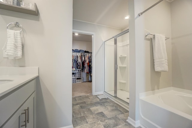1470 Talley Ridge Dr, Woodruff, SC 29388 - full bathroom featuring a stall shower, a garden tub, a spacious closet, stone finish floors, and recessed lighting