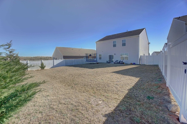 1470 Talley Ridge Dr, Woodruff, SC 29388 - back of house with a trampoline and a fenced backyard