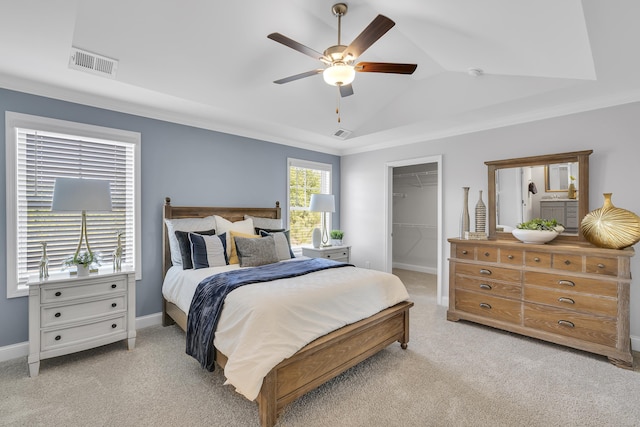 1034 Silverbend Trl, Duncan, SC 29334 - bedroom with light carpet, a walk in closet, vaulted ceiling, ceiling fan, and a closet