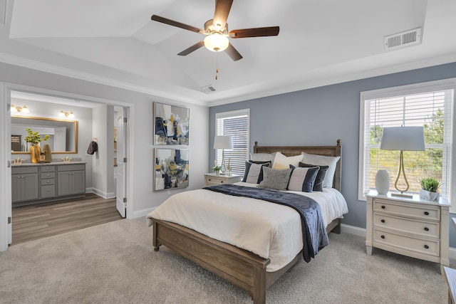 1034 Silverbend Trl, Duncan, SC 29334 - carpeted bedroom with vaulted ceiling, ensuite bath, a ceiling fan, and crown molding
