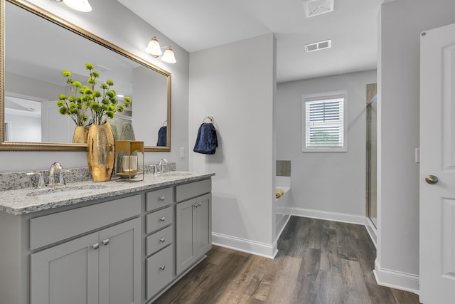 1034 Silverbend Trl, Duncan, SC 29334 - full bath with double vanity, a garden tub, wood finished floors, and a shower stall