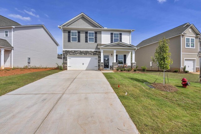 1034 Silverbend Trl, Duncan, SC 29334 - craftsman-style house with driveway, covered porch, a garage, stone siding, and a front lawn