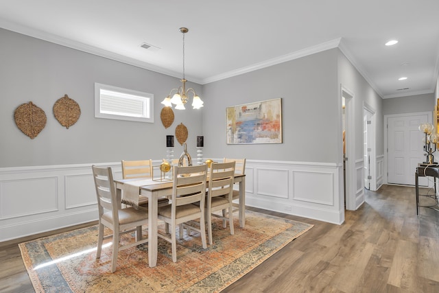 1034 Silverbend Trl, Duncan, SC 29334 - dining space featuring ornamental molding, a chandelier, wood finished floors, a wainscoted wall, and recessed lighting