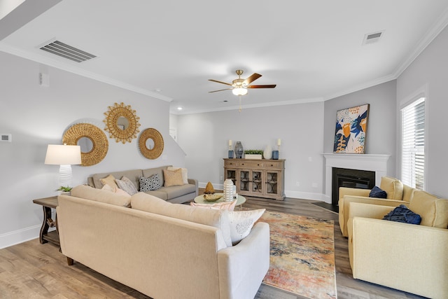 1034 Silverbend Trl, Duncan, SC 29334 - living area with wood finished floors, ceiling fan, crown molding, a fireplace with flush hearth, and recessed lighting