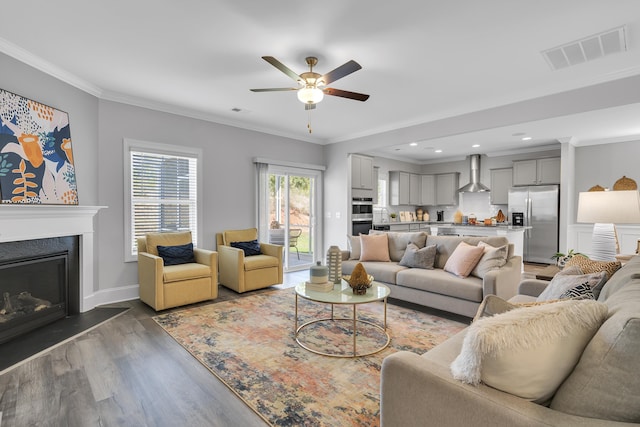 1034 Silverbend Trl, Duncan, SC 29334 - living area featuring ceiling fan, wood finished floors, a fireplace, ornamental molding, and recessed lighting