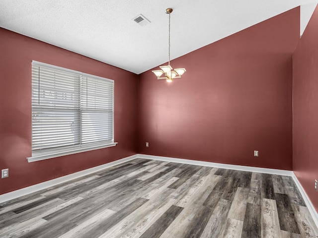 461 Candleglow Dr, Boiling Springs, SC 29316 - spare room with wood finished floors, a chandelier, and a textured ceiling
