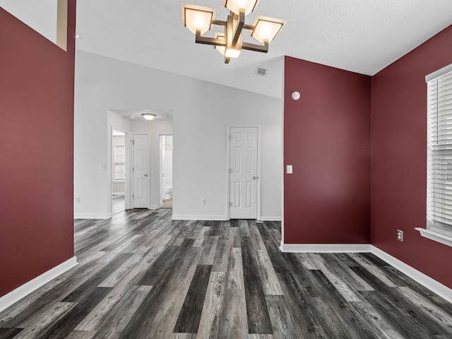 461 Candleglow Dr, Boiling Springs, SC 29316 - unfurnished living room featuring dark wood finished floors and a chandelier