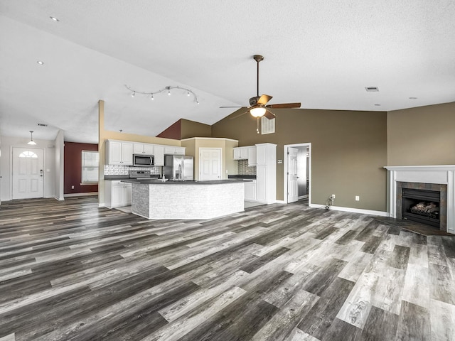 461 Candleglow Dr, Boiling Springs, SC 29316 - kitchen featuring stainless steel appliances, open floor plan, dark countertops, white cabinets, and dark wood-style floors
