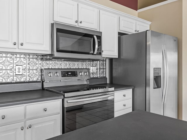 461 Candleglow Dr, Boiling Springs, SC 29316 - kitchen with appliances with stainless steel finishes, dark countertops, white cabinets, and decorative backsplash