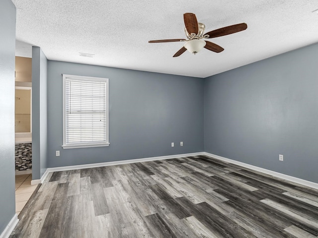 461 Candleglow Dr, Boiling Springs, SC 29316 - empty room with wood finished floors, ceiling fan, and a textured ceiling