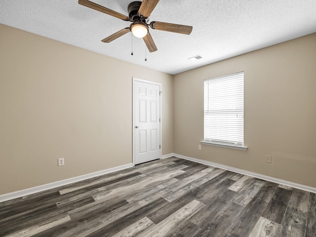 461 Candleglow Dr, Boiling Springs, SC 29316 - spare room with dark wood-type flooring, a textured ceiling, and ceiling fan