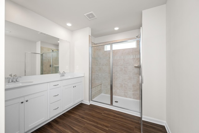 305 Novelty Dr, Greer, SC 29651 - full bath featuring a shower stall, double vanity, wood finished floors, and recessed lighting