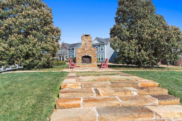 305 Novelty Dr, Greer, SC 29651 - view of front of house with an outdoor stone fireplace, a chimney, a front yard, and stone siding
