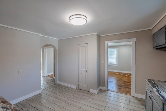 107 Ravenscroft St, Union, SC 29379 - unfurnished room featuring arched walkways, ornamental molding, and light tile patterned flooring