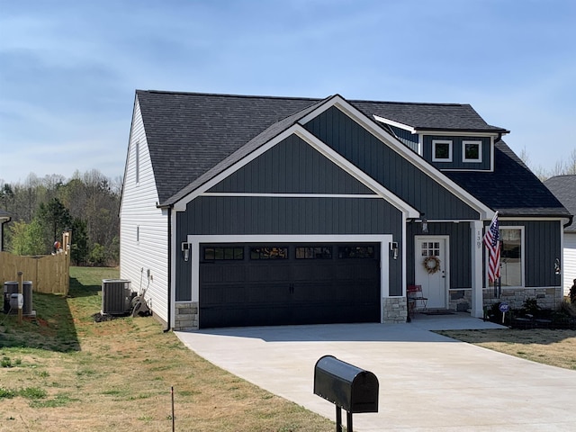 138 Lowe Rd, Chesnee, SC 29323 - view of front facade featuring driveway, a garage, roof with shingles, and stone siding