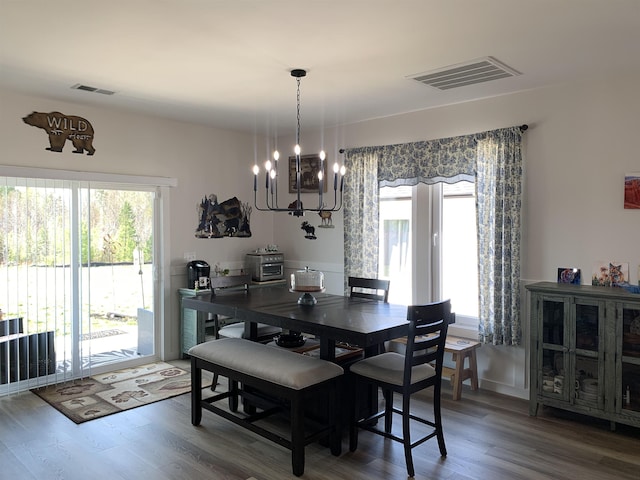 138 Lowe Rd, Chesnee, SC 29323 - dining room featuring a chandelier and wood finished floors