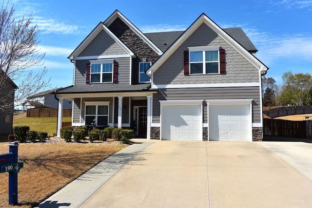 190 Colfax Dr, Boiling Springs, SC 29316 - craftsman-style house featuring an attached garage, covered porch, stone siding, and driveway