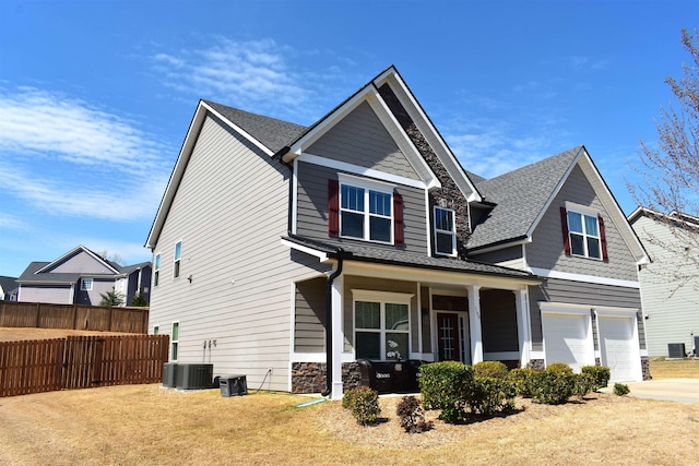 190 Colfax Dr, Boiling Springs, SC 29316 - craftsman-style house with covered porch, stone siding, an attached garage, concrete driveway, and roof with shingles