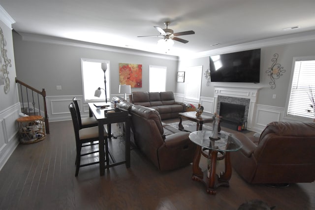 190 Colfax Dr, Boiling Springs, SC 29316 - living room with ceiling fan, ornamental molding, a stone fireplace, a decorative wall, and wood finished floors